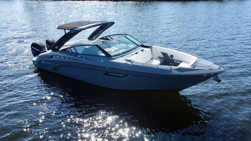 Slide: The Image of 2021 Cruisers Yachts 338 South Beach Edition Bow Rider on shimmering water. - 4