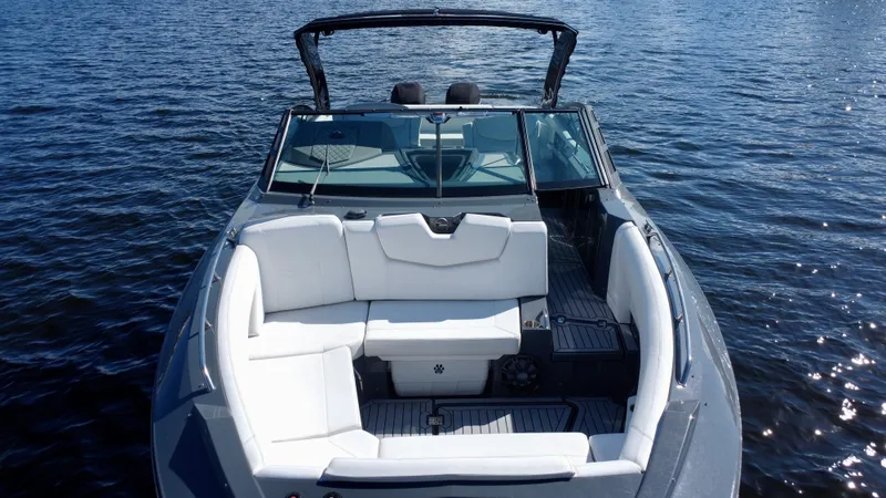 Slide: The Image of 2021 Cruisers Yachts 338 South Beach Edition Bow Rider on water, featuring sleek design. - 7