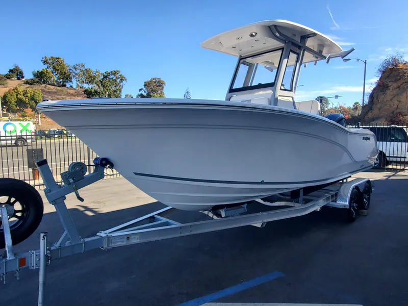 Slide: The Image of 2025 Sea Fox 228 Commander boat on trailer, parked outdoors. - 1