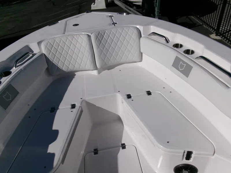 Slide: The Image of 2025 Sea Fox 228 Commander boat interior with white seating and storage compartments. - 10
