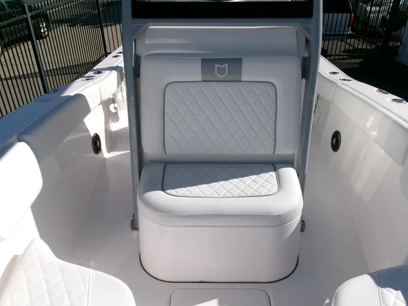 Slide: The Image of 2025 Sea Fox 228 Commander boat interior with cushioned seating and sleek design. - 12