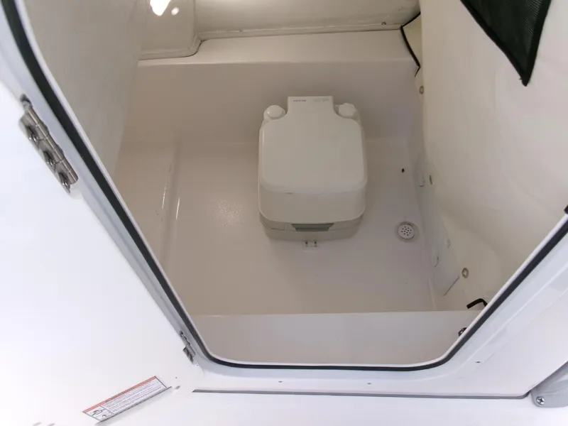Slide: The Image of Portable toilet inside 2025 Sea Fox 228 Commander boat compartment. - 17