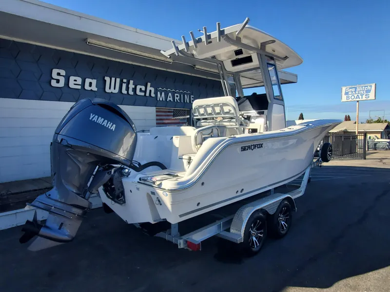 Slide: The Image of 2025 Sea Fox 228 Commander boat with Yamaha engine at Sea Witch Marine dealership. - 2