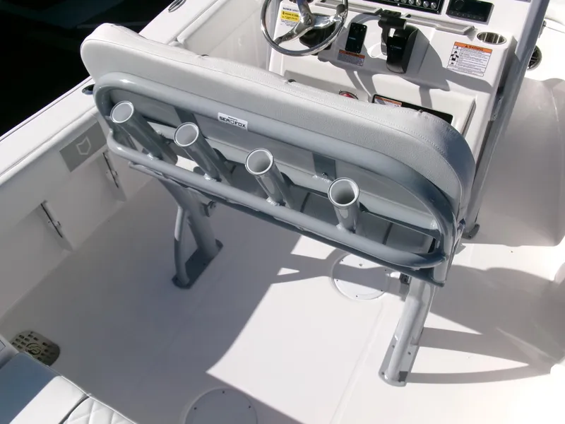 Slide: The Image of 2025 Sea Fox 228 Commander boat interior with rod holders and steering console. - 22