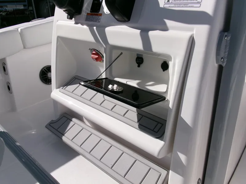 Slide: The Image of 2025 Sea Fox 228 Commander boat console with storage compartment and control panel. - 24