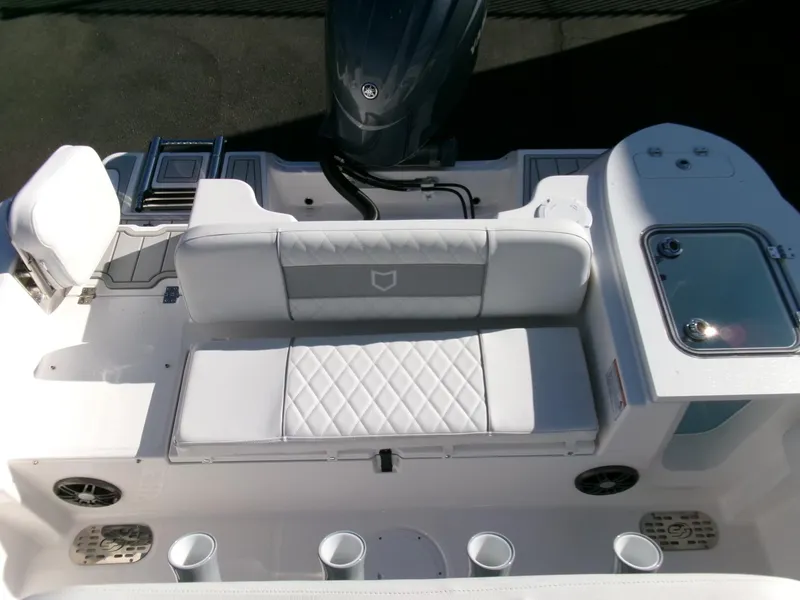 Slide: The Image of 2025 Sea Fox 228 Commander boat interior with cushioned seating and storage compartments. - 26