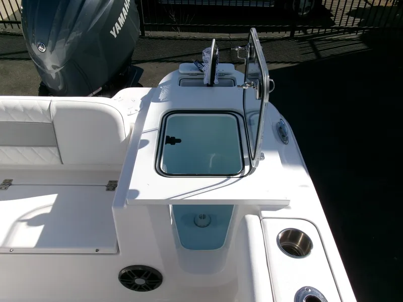 Slide: The Image of 2025 Sea Fox 228 Commander boat interior with Yamaha engine, featuring seating and storage compartments. - 28