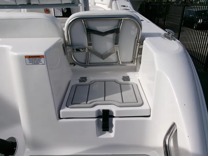Slide: The Image of 2025 Sea Fox 228 Commander boat interior with seating and storage compartment. - 32