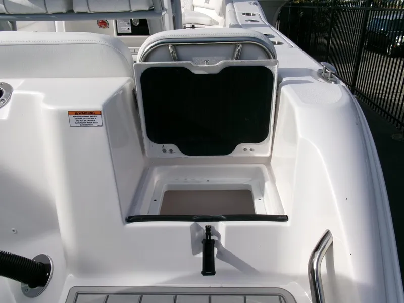 Slide: The Image of 2025 Sea Fox 228 Commander boat interior with storage compartment and seating area. - 33
