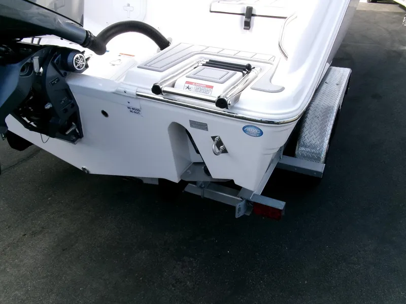 Slide: The Image of 2025 Sea Fox 228 Commander boat on trailer, rear view showing motor mount and deck. - 34