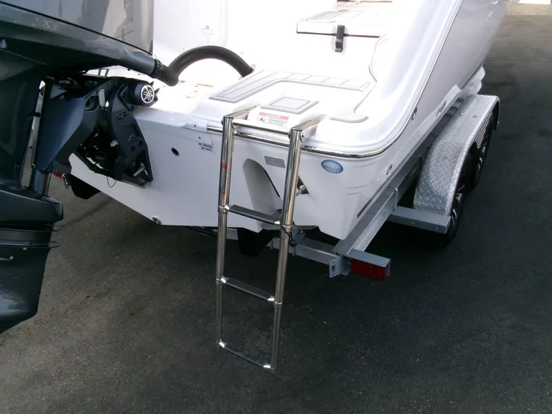 Slide: The Image of 2025 Sea Fox 228 Commander boat with ladder and trailer, rear view. - 35