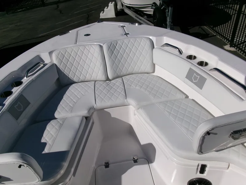 Slide: The Image of 2025 Sea Fox 228 Commander boat with white cushioned seating and cup holders. - 7