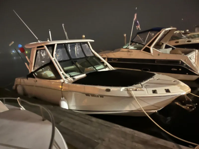 Slide: The Image of 2023 Boston Whaler 240 Vantage boat docked at night, side view. - 0