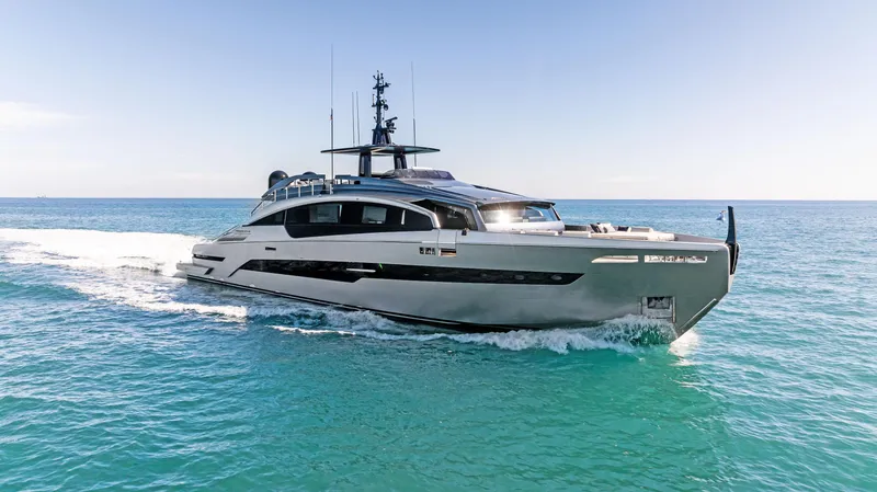 The Image of 2023 Pershing GTX 116 yacht cruising on clear blue ocean waters. - 0