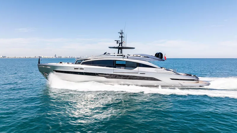 Slide: The Image of 2023 Pershing GTX 116 yacht cruising on open sea under clear blue sky. - 2