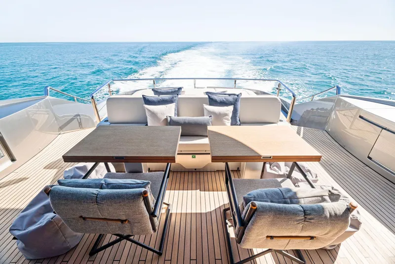 Slide: The Image of Luxury deck of 2023 Pershing GTX 116 yacht with ocean view and elegant seating. - 26
