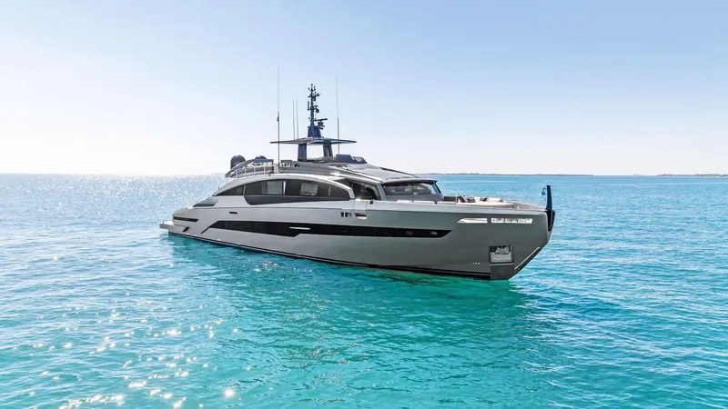Slide: The Image of 2023 Pershing GTX 116 yacht on clear blue ocean waters. - 3