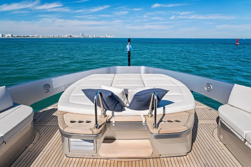 Slide: The Image of Luxurious 2023 Pershing GTX 116 yacht deck with ocean view and plush seating. - 35