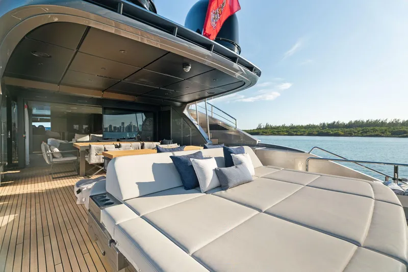 Slide: The Image of Luxurious 2023 Pershing GTX 116 yacht deck with sun loungers and scenic ocean view. - 40