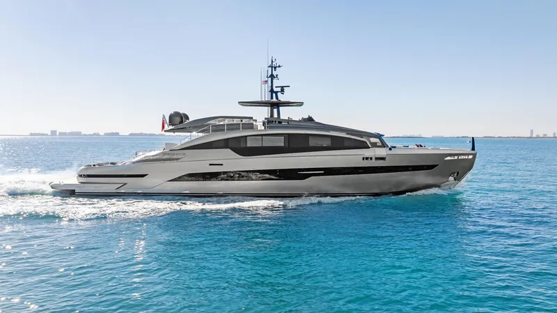 Slide: The Image of 2023 Pershing GTX 116 yacht cruising on clear blue ocean waters. - 5