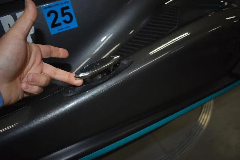 Slide: The Image of 2023 Yamaha WaveRunner VX Cruiser® with a hand near a chrome detail. - 16