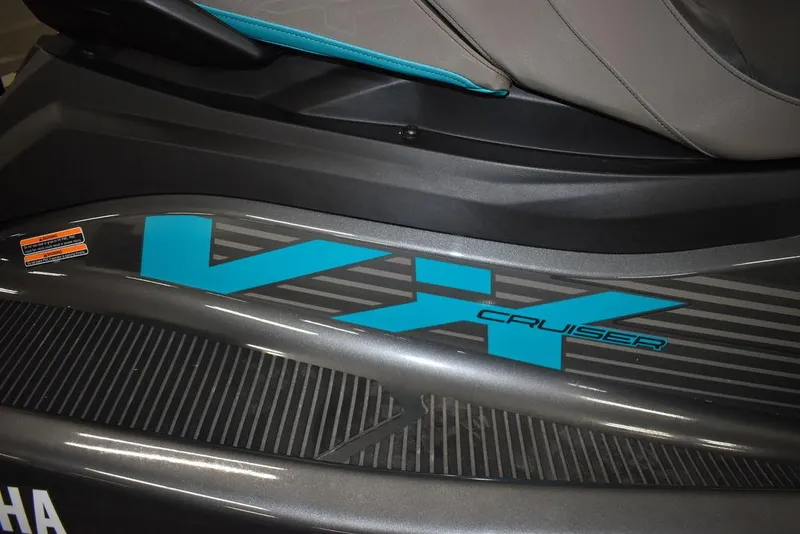 Slide: The Image of 2023 Yamaha WaveRunner VX Cruiser® logo on sleek black body. - 17
