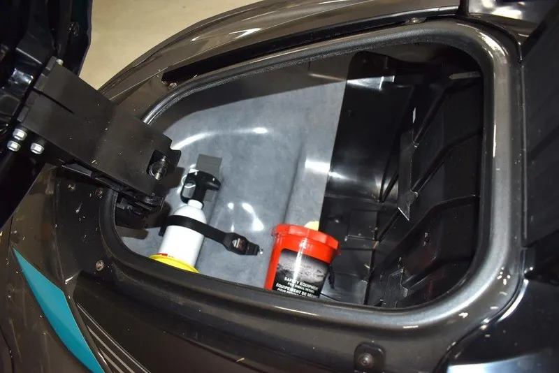 Slide: The Image of 2023 Yamaha WaveRunner VX Cruiser® storage compartment with safety equipment and container. - 27