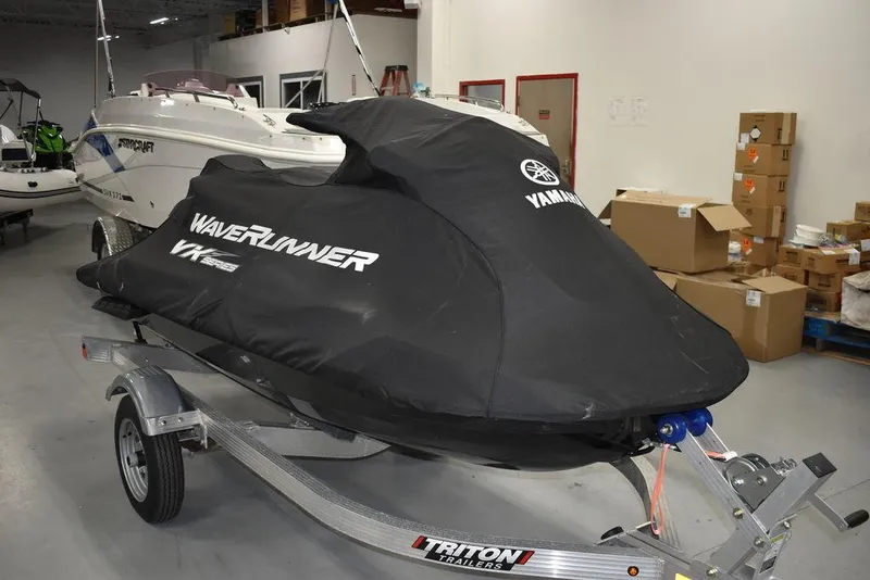Slide: The Image of 2023 Yamaha WaveRunner VX Cruiser® covered on a trailer in a showroom. - 30