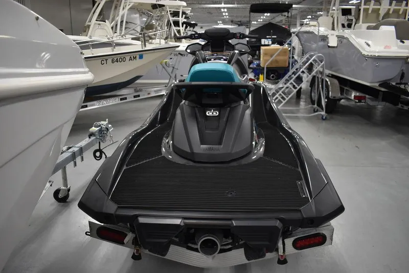 Slide: The Image of 2023 Yamaha WaveRunner VX Cruiser® in showroom, surrounded by boats. - 5