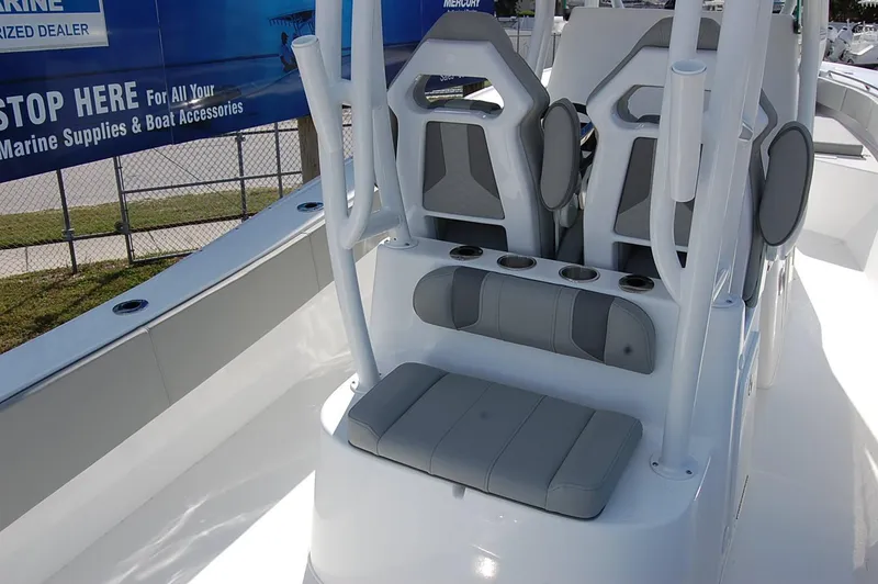 Slide: The Image of 2025 Cape Horn 28XS boat interior with modern seating and cup holders. - 11