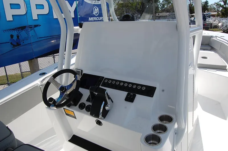 Slide: The Image of 2025 Cape Horn 28XS boat console with steering wheel and controls. - 12