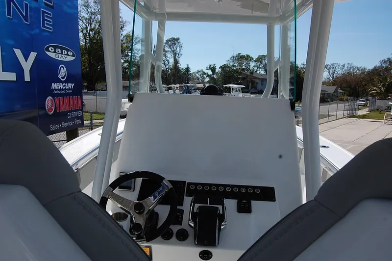 Slide: The Image of 2025 Cape Horn 28XS boat cockpit with steering wheel and control panel. - 15