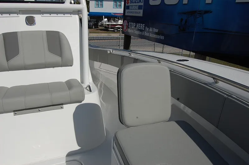 Slide: The Image of 2025 Cape Horn 28XS boat interior with gray seating and white deck. - 21