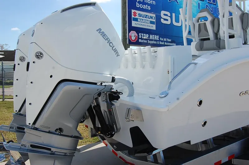 Slide: The Image of 2025 Cape Horn 28XS boat with Mercury outboard engine, displayed outdoors. - 3