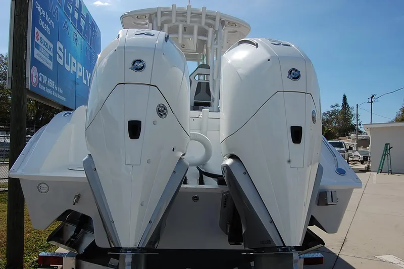 Slide: The Image of 2025 Cape Horn 28XS boat with dual outboard engines, rear view. - 4