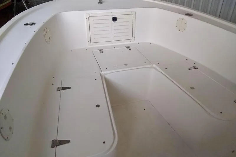 Slide: The Image of 1996 Mako 262 Center Console boat interior with storage compartments. - 8