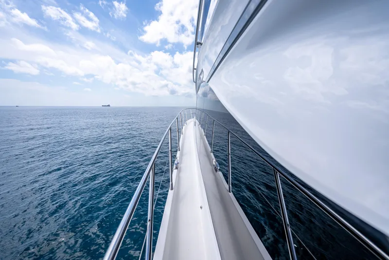 Slide: The Image of 2023 Princess F65 yacht cruising on open sea under blue sky. - 16