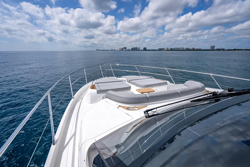 Slide: The Image of 2023 Princess F65 yacht deck with ocean view and city skyline in the distance. - 17