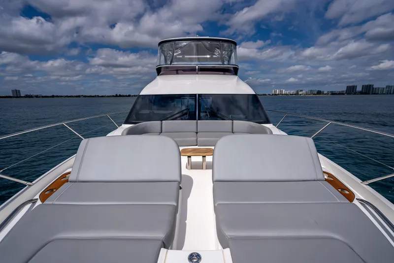 Slide: The Image of 2023 Princess F65 yacht with luxurious deck seating on open water. - 19