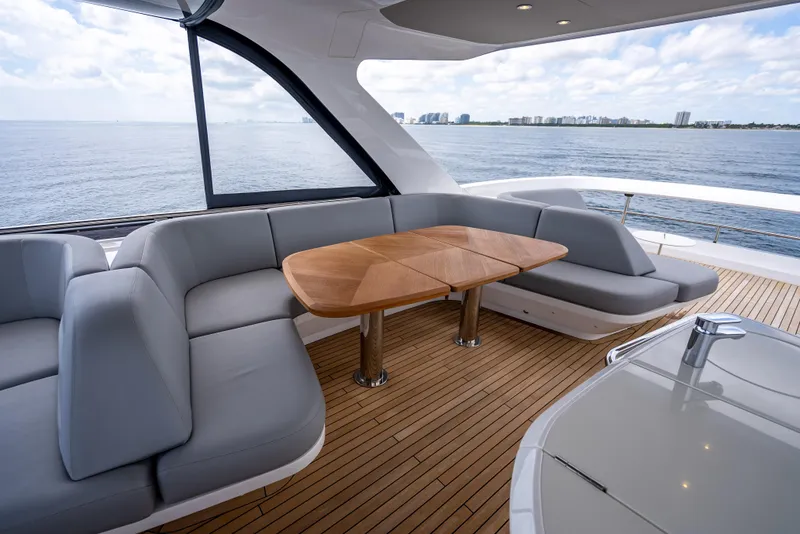Slide: The Image of Luxurious 2023 Princess F65 yacht interior with elegant seating and ocean view. - 23