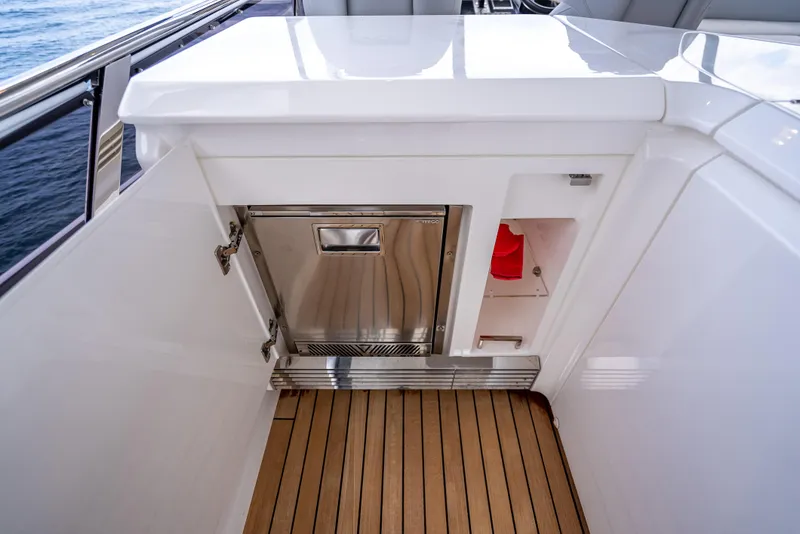 Slide: The Image of 2023 Princess F65 yacht interior with sleek cabinetry and wooden flooring. - 26
