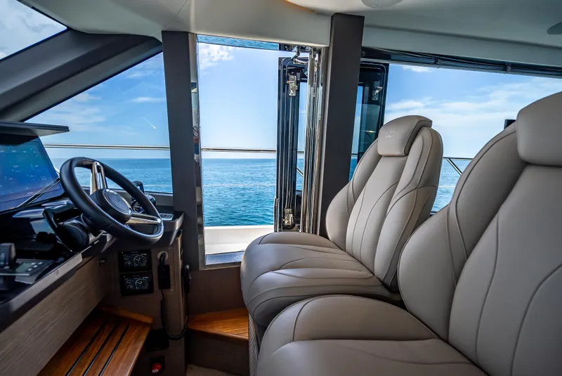 Slide: The Image of Interior of 2023 Princess F65 yacht, featuring luxurious seating and ocean view. - 28