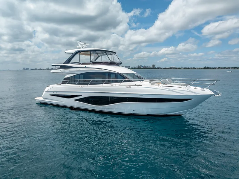Slide: The Image of 2023 Princess F65 yacht cruising on open water under a partly cloudy sky. - 3