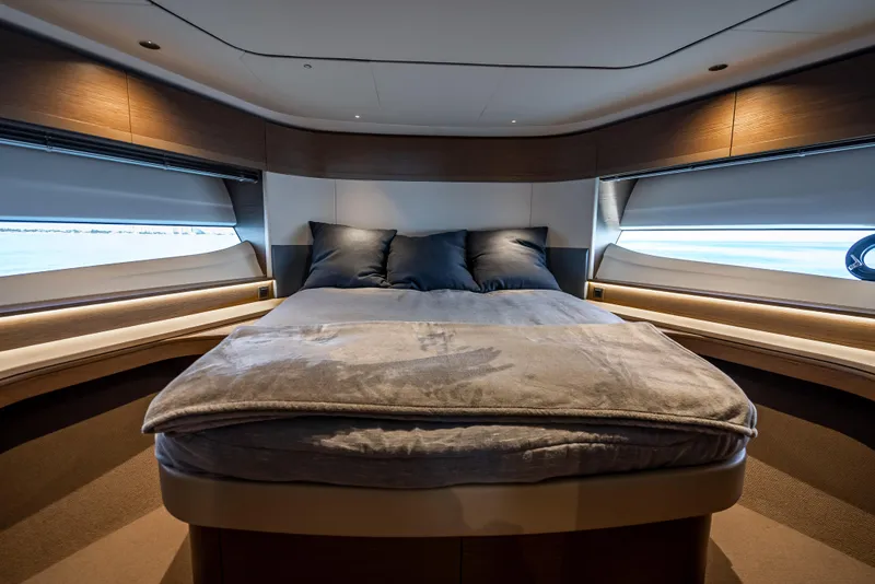 Slide: The Image of Luxurious bedroom interior of 2023 Princess F65 yacht with modern design and cozy bedding. - 43