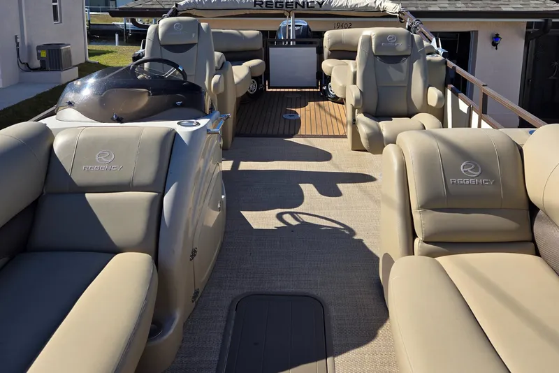 Slide: The Image of Luxurious 2017 Regency 254 LE3 pontoon boat with plush seating and elegant design. - 11