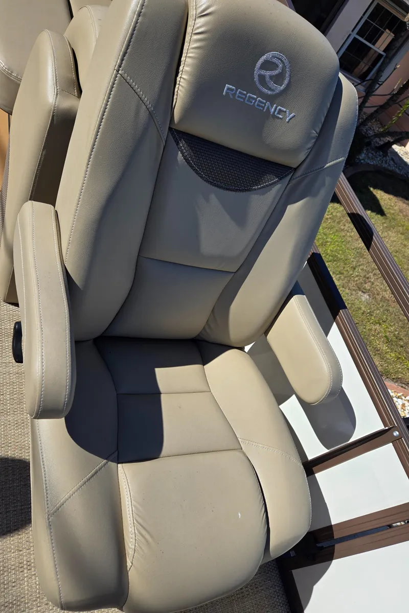 Slide: The Image of 2017 Regency 254 LE3 boat seat, gray leather, outdoor setting. - 13