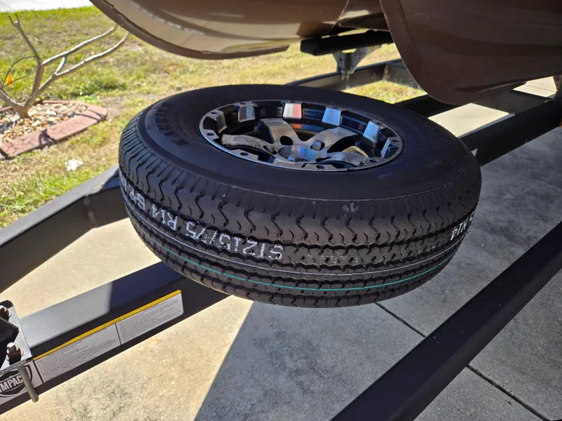Slide: The Image of Spare tire mounted on a 2017 Regency 254 LE3 trailer. - 18