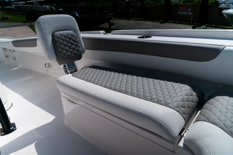 Slide: The Image of 2025 Caymas 28 HB boat interior with quilted seating and modern design. - 17