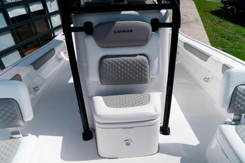 Slide: The Image of 2025 Caymas 28 HB boat interior with cushioned seating and sleek design. - 18