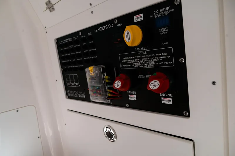 Slide: The Image of Electrical panel of 2025 Caymas 28 HB boat, featuring switches and meters. - 24